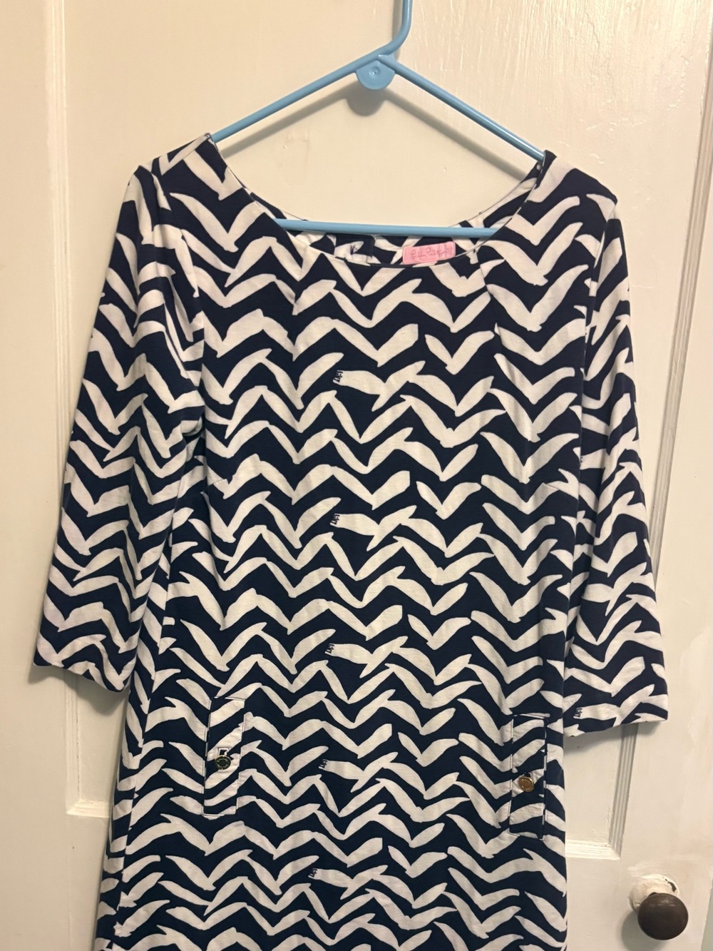 Navy white dress size large Knee length at 5’5” tall
All Lilly labels on